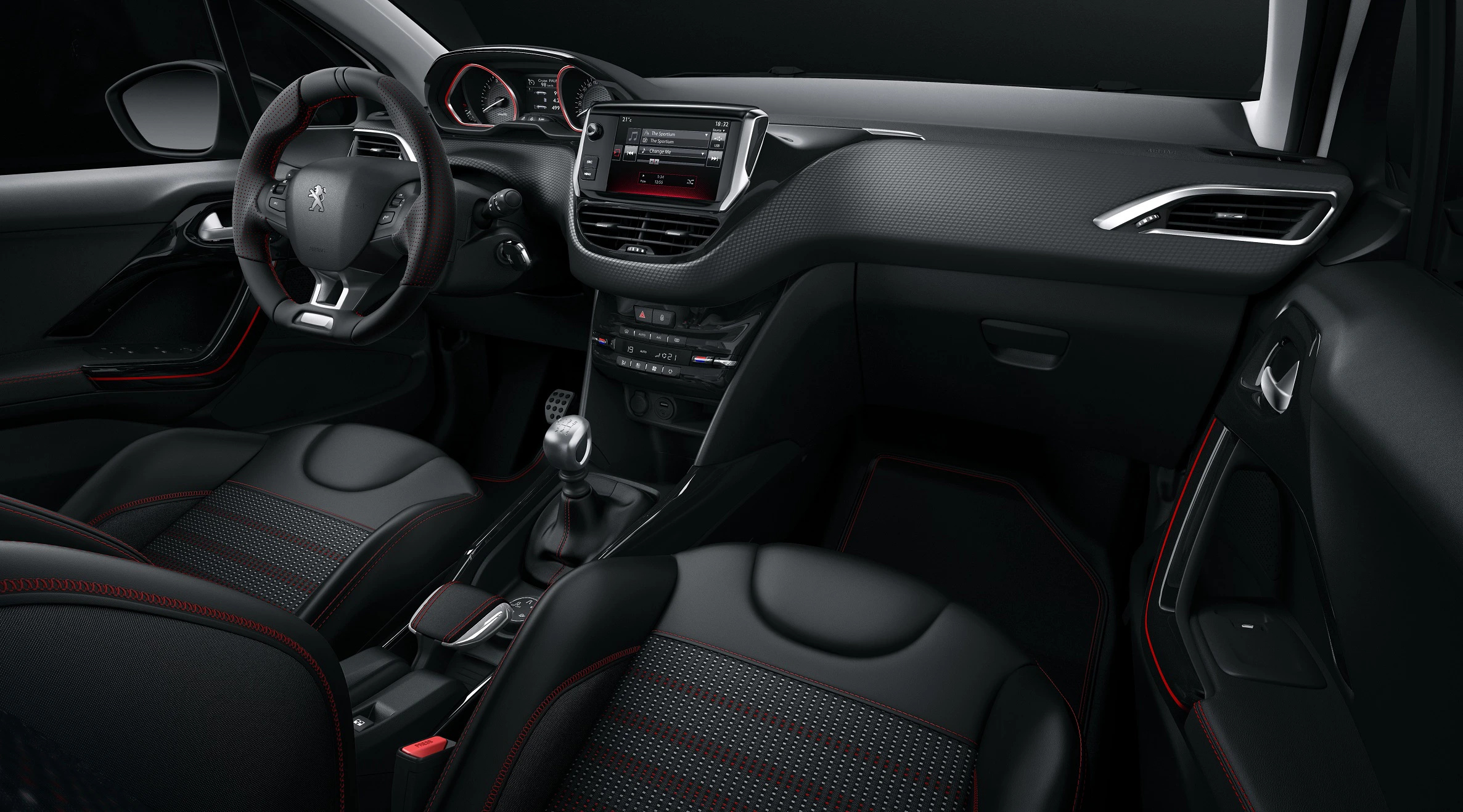 Innenraum eines modernen Autos mit schwarzem Leder, roten Nähten, handgeschaltetem Getriebe und digitalem Armaturenbrett.