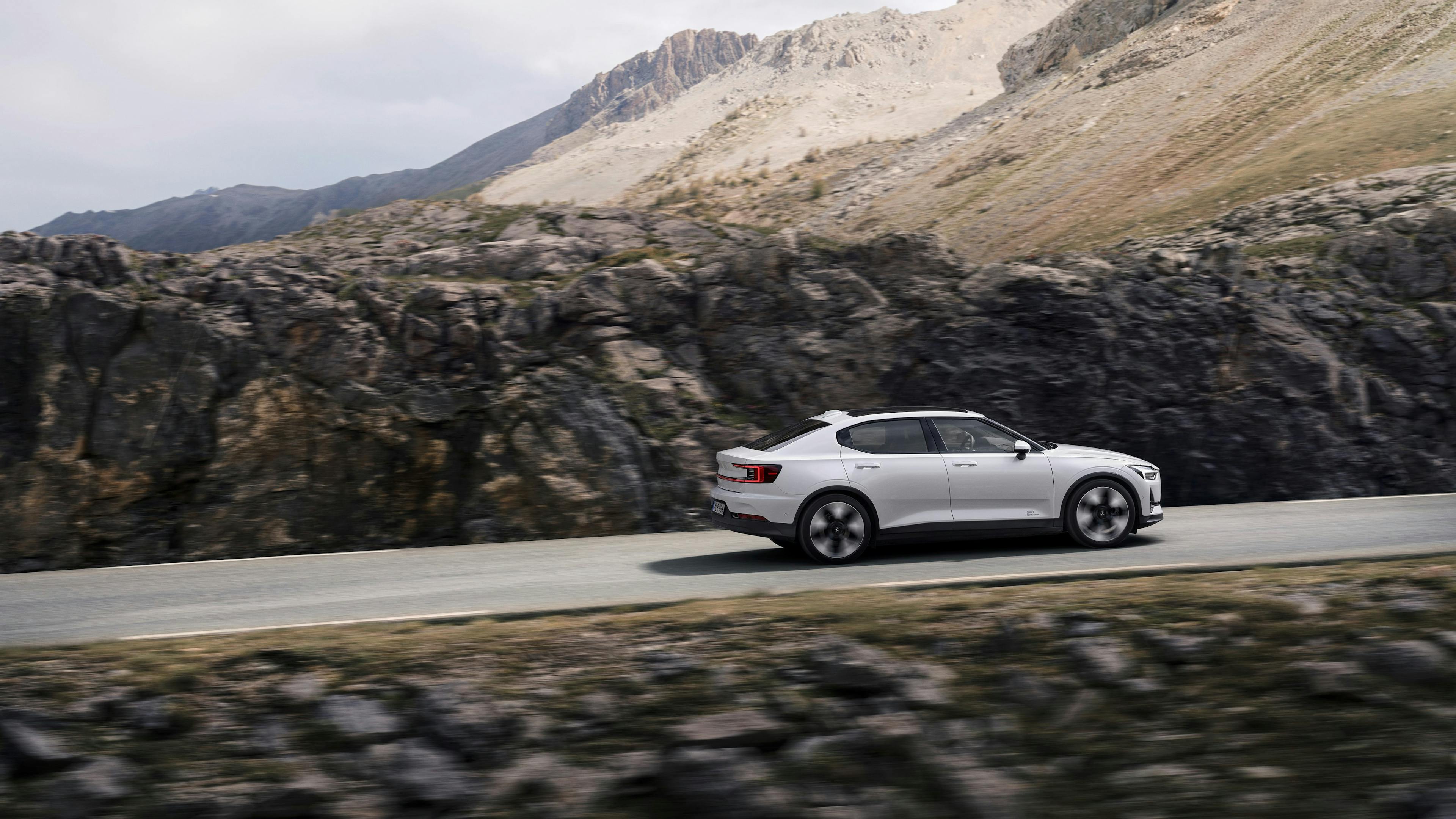 The Polestar 2 on a road in the mountains