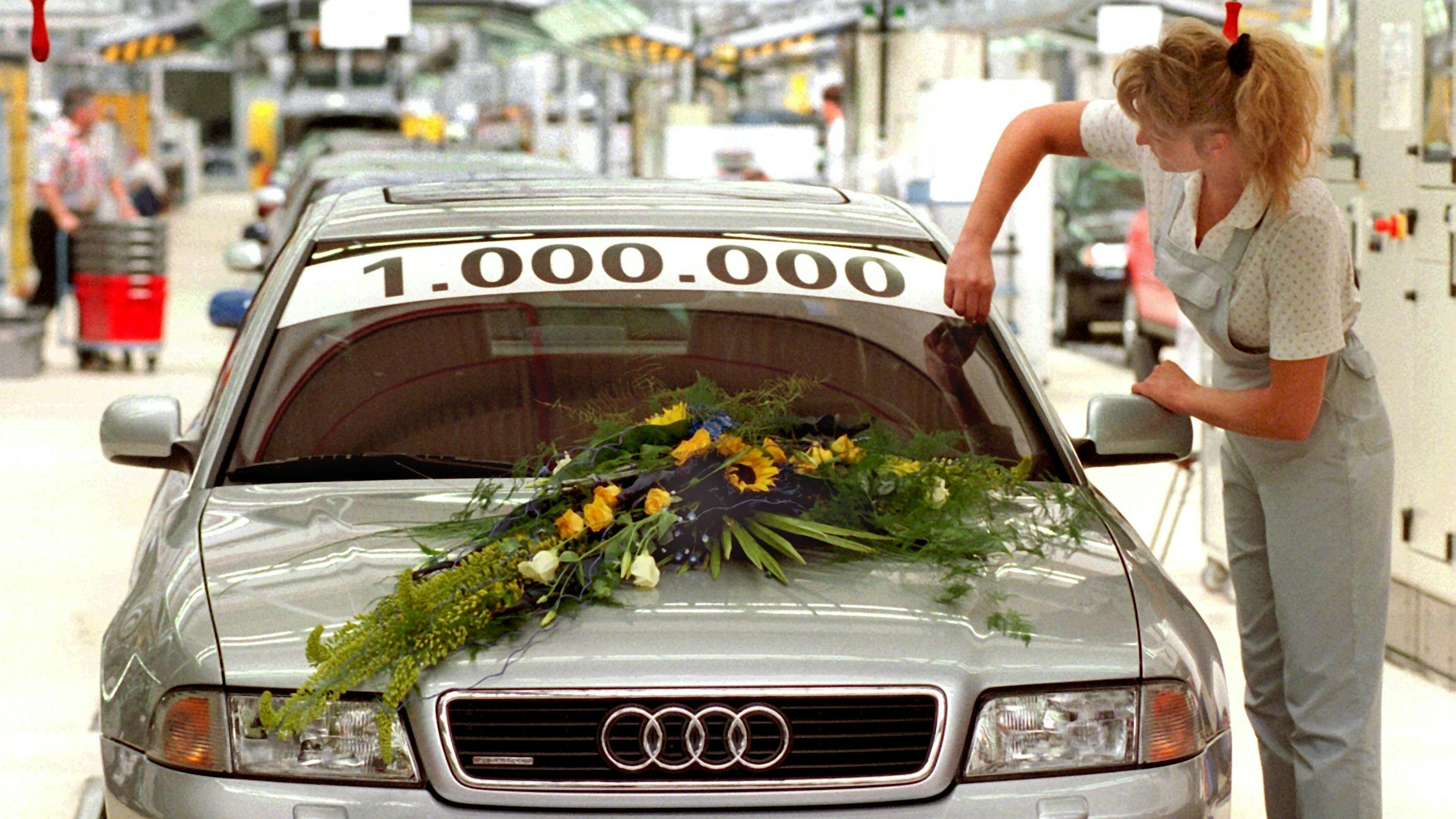 Audi A4 with sticker 1 million and floral decoration