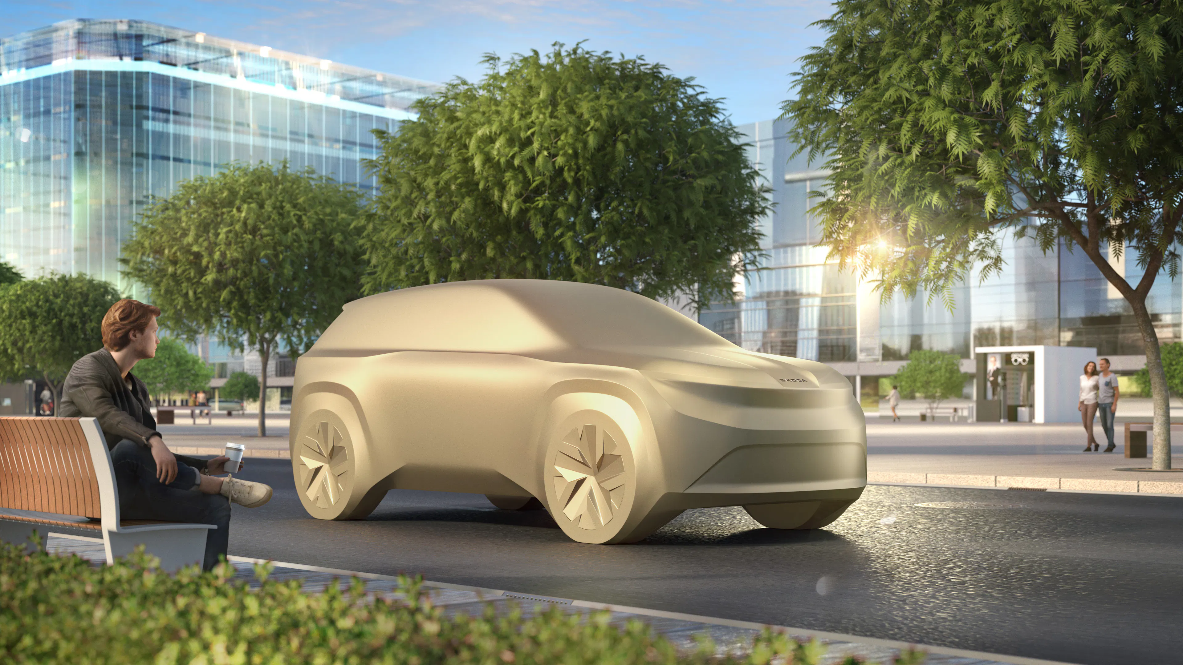 Ein Modell eines kommenden Fahrzeugs von Škoda vor einem urbanen Hintergrund.