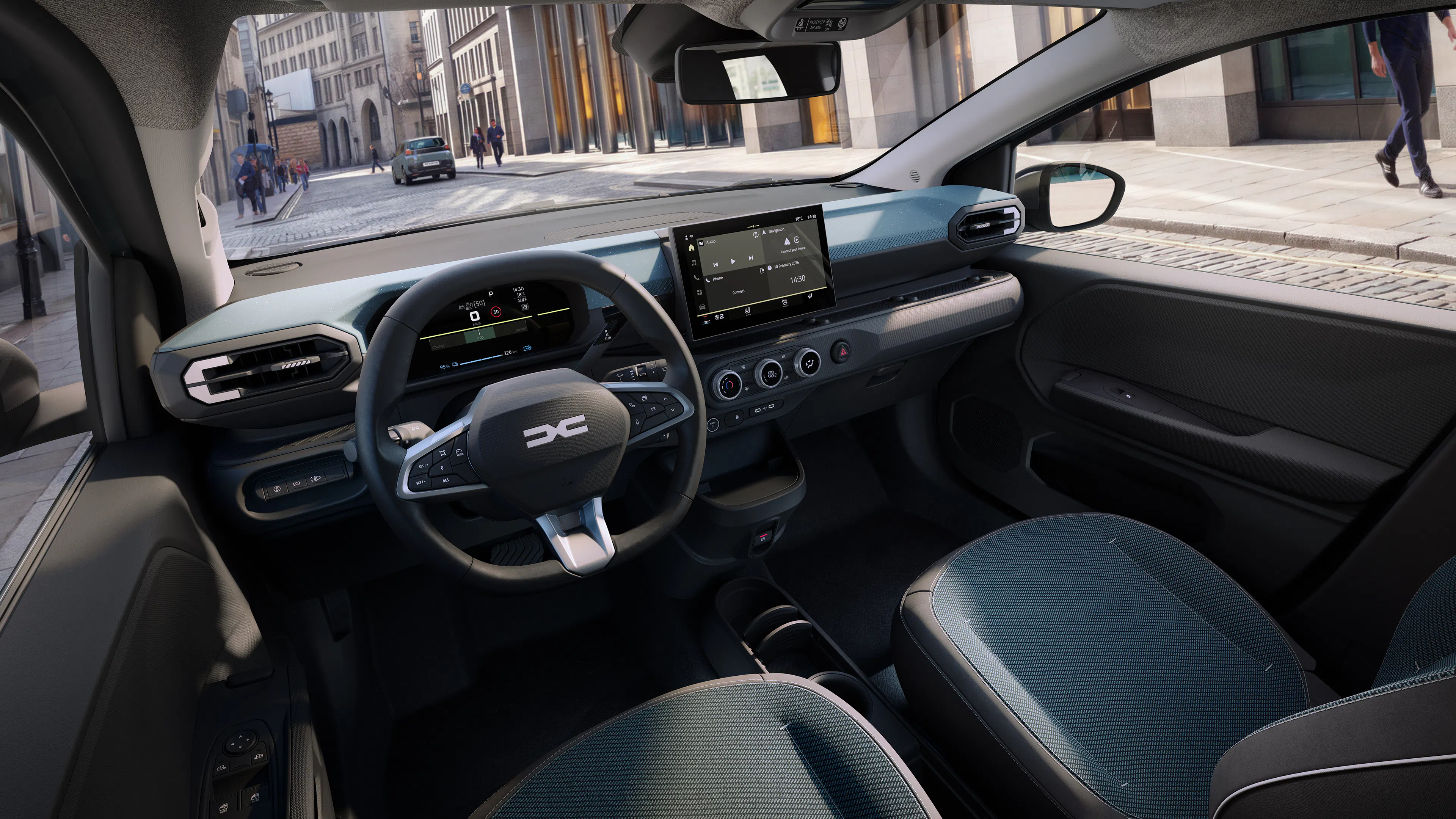 Cockpit des Dacia Spring 2 mit Lenkrad, Digitaltacho und zentralem Touchscreen.
