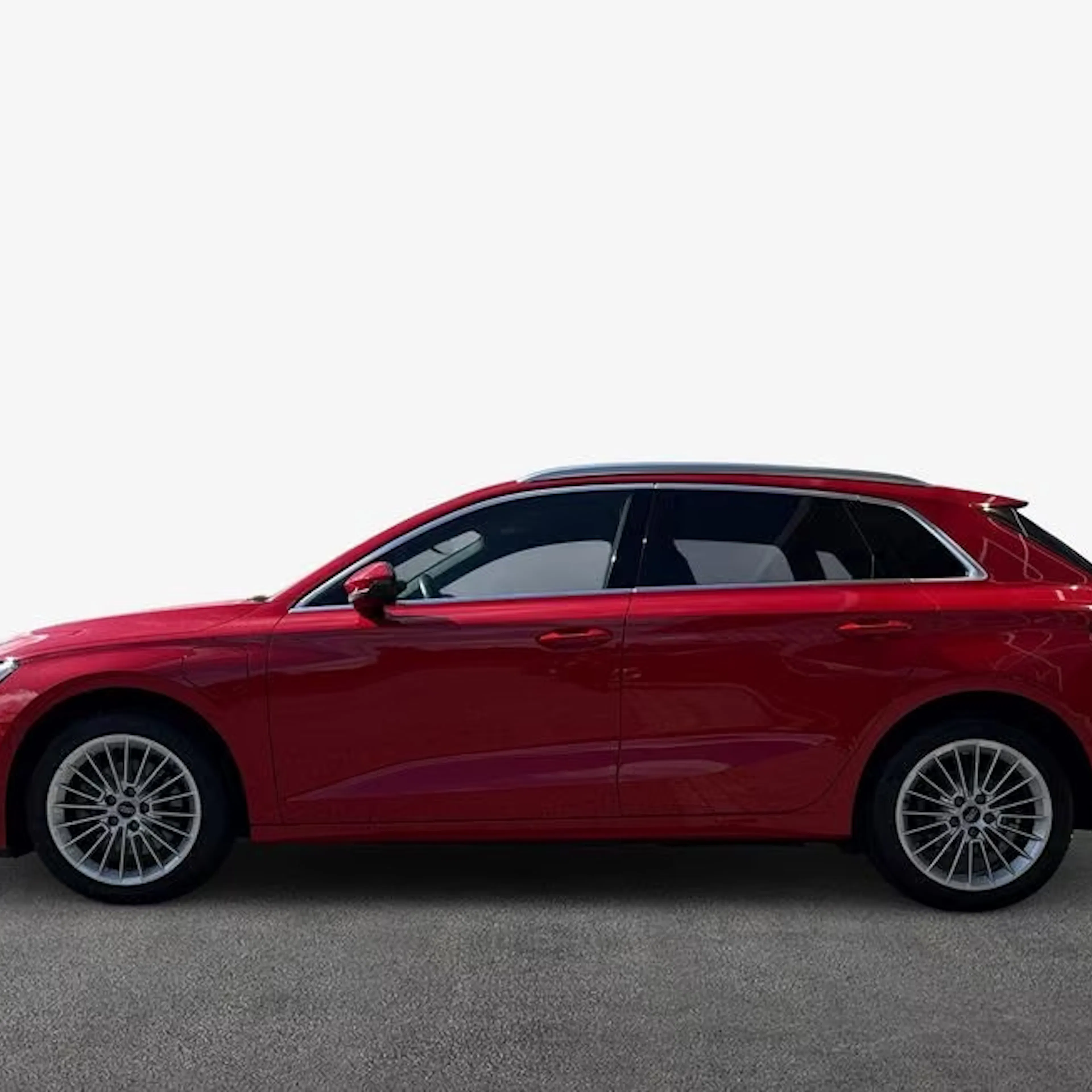 Ein roter Audi A3 Sportback steht auf einer gepflasterten Fläche.