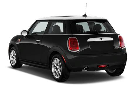 Schwarzer Kleinwagen mit weißem Dach und roten Rückleuchten, steht auf Asphalt. Seitenansicht, Blick auf das Heck.