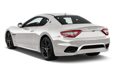 Weißer Sportwagen mit zwei Türen, eleganter Form und schwarzen Felgen, von hinten gesehen.