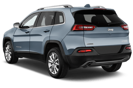 Grauer Jeep Cherokee von hinten, geparkt, zeigt Rücklichter und Heckklappe. Klarer Himmel im Hintergrund.