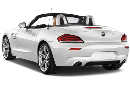 Weißer Sportwagen mit offenem Verdeck, stilvollem Design und charakteristischem BMW-Logo am Heck, zeigt elegante Linien und Doppelauspuff.