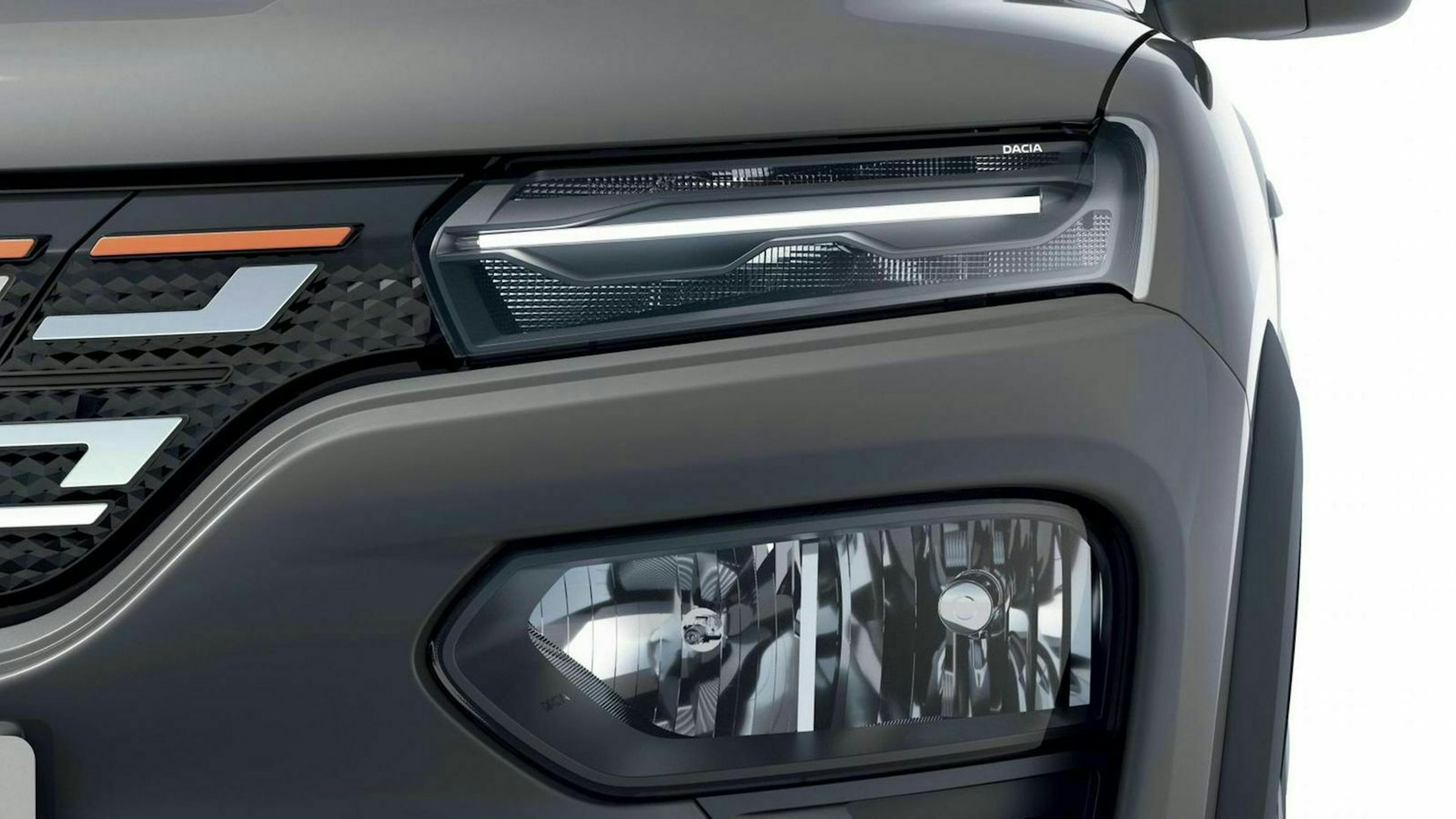 Der Dacia Spring Electric mit Sicht auf den Frontscheinwerfer