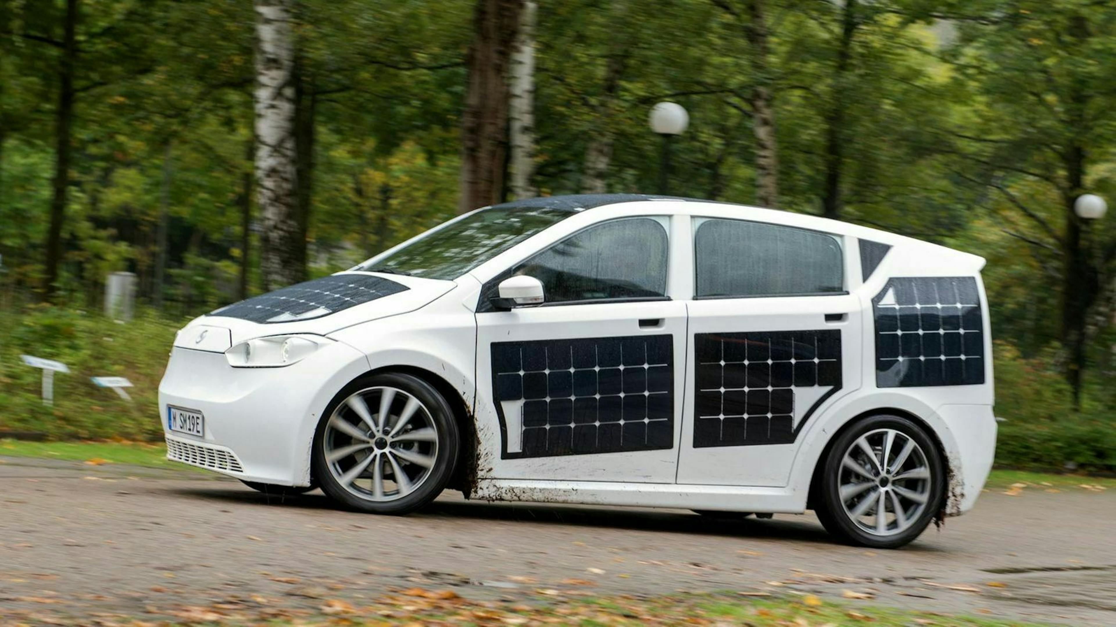 It shows a car covered with solar cells