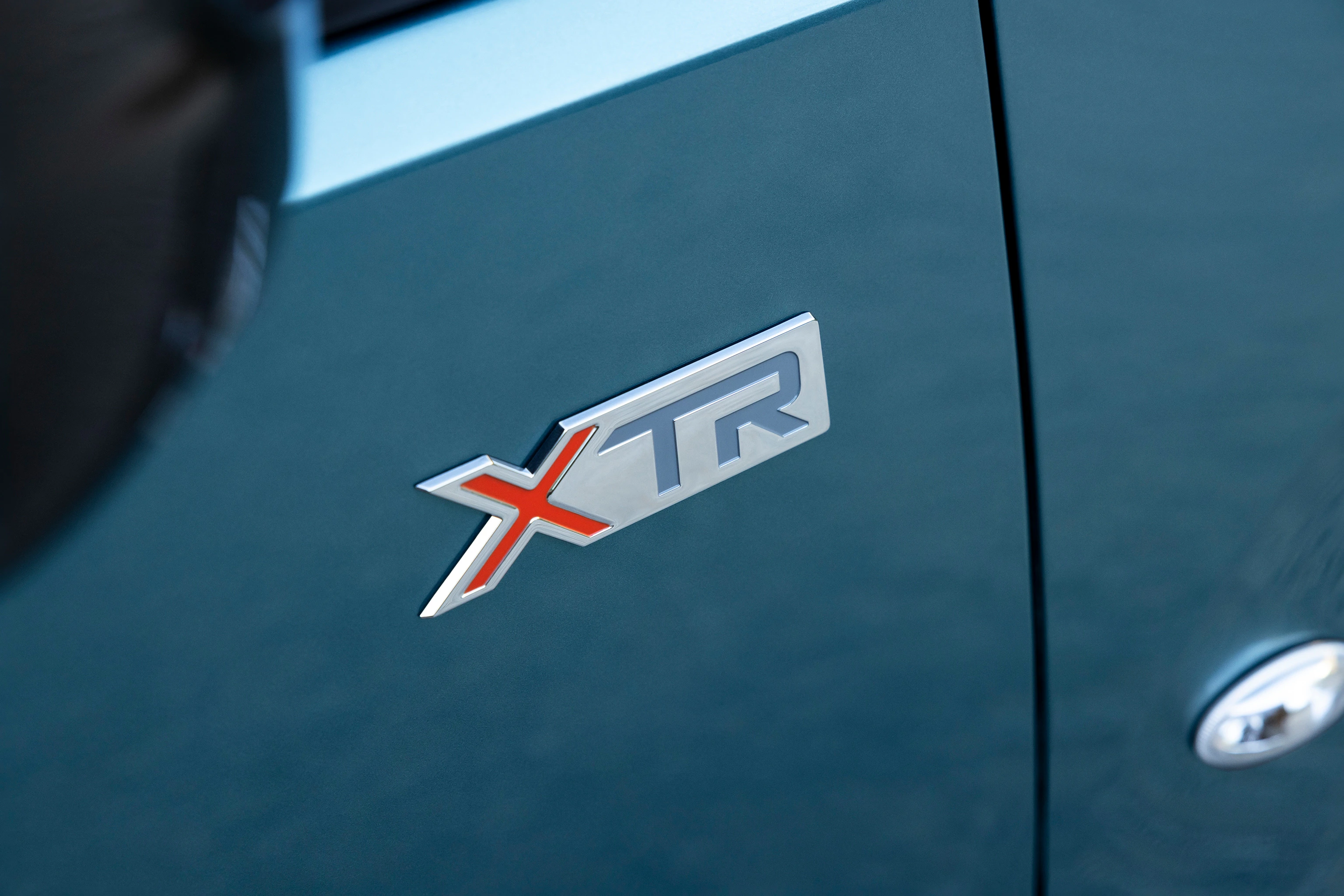 Ein XTR Emblem an einem Citroen e-Berlingo