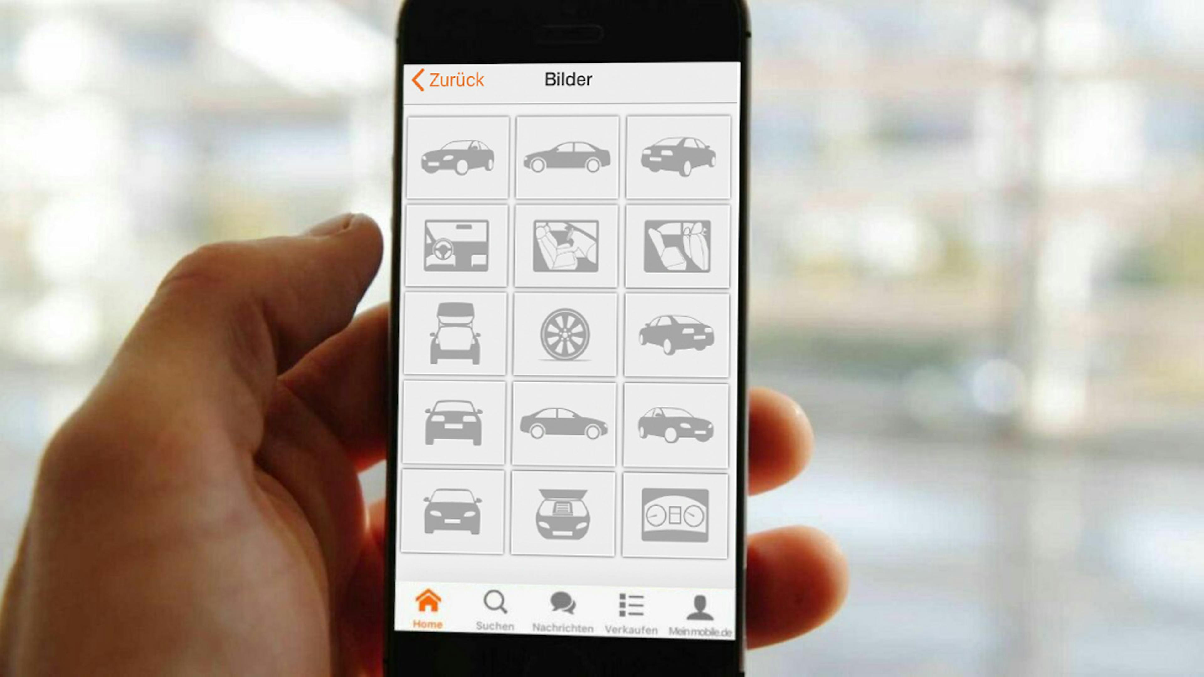 Ein Handy zeigt die mobile.de-App.