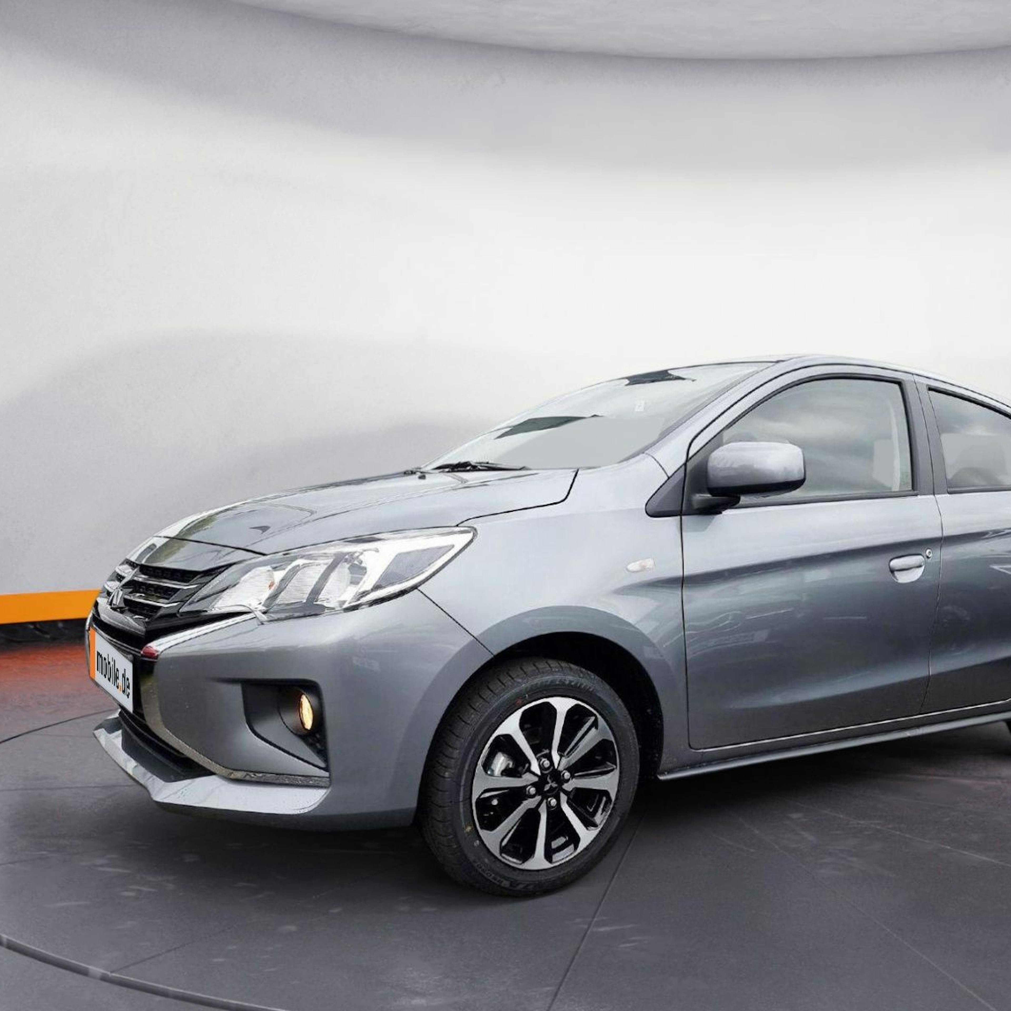 A gray Mitsubishi Space Star in the showroom