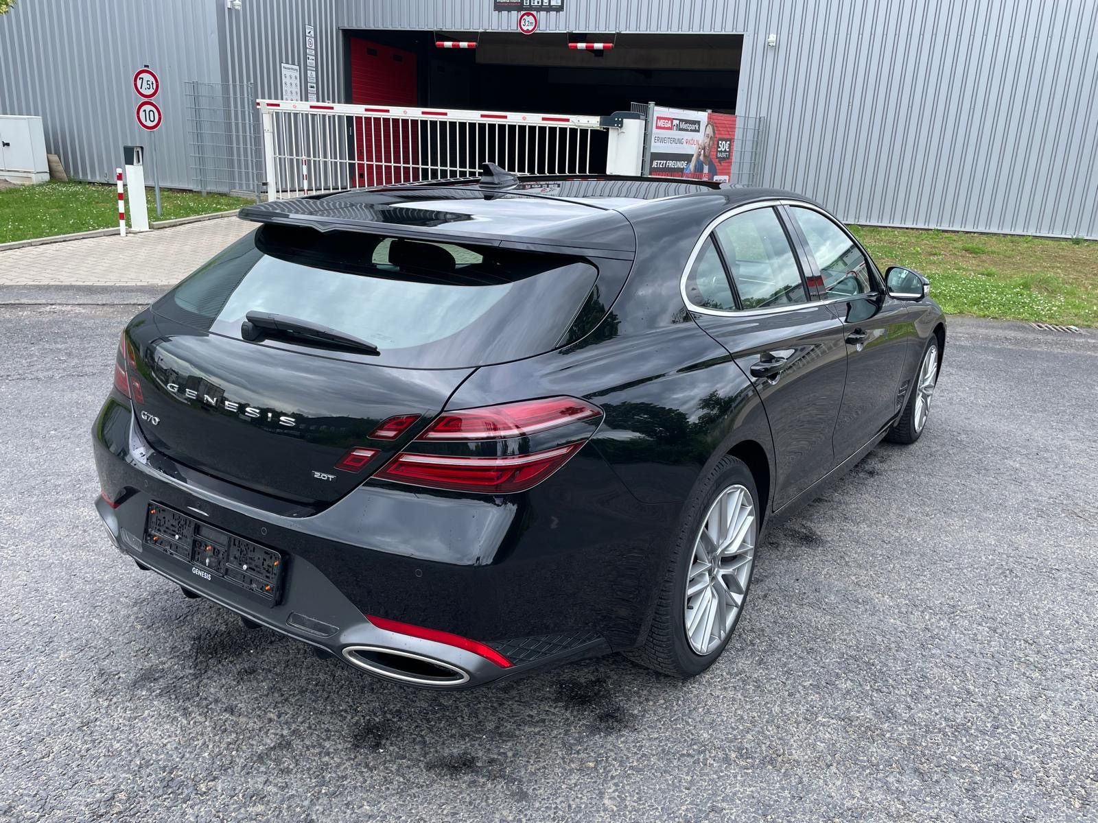A black Genesis G70 Shooting Brake, rear view.