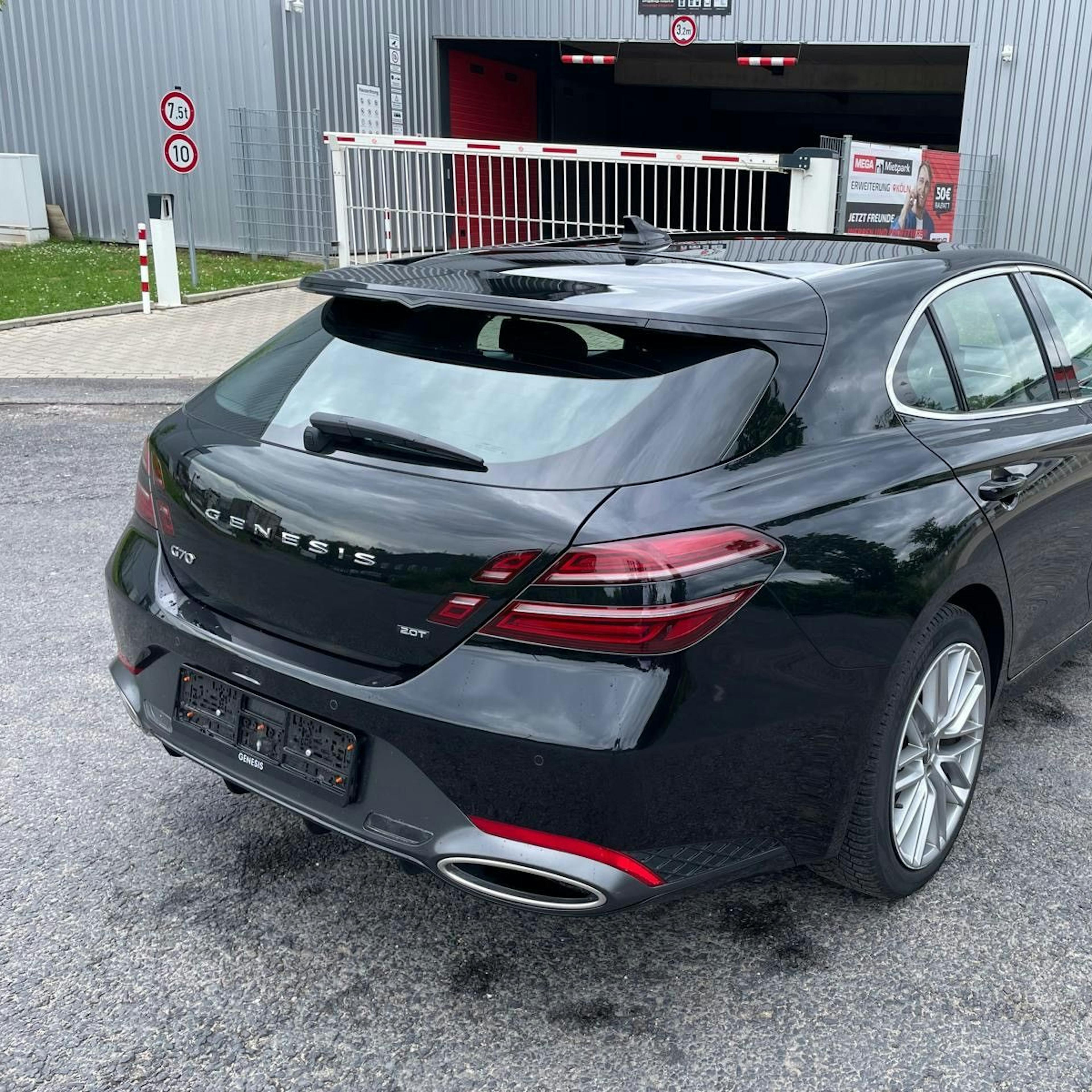 A black Genesis G70 Shooting Brake, rear view.