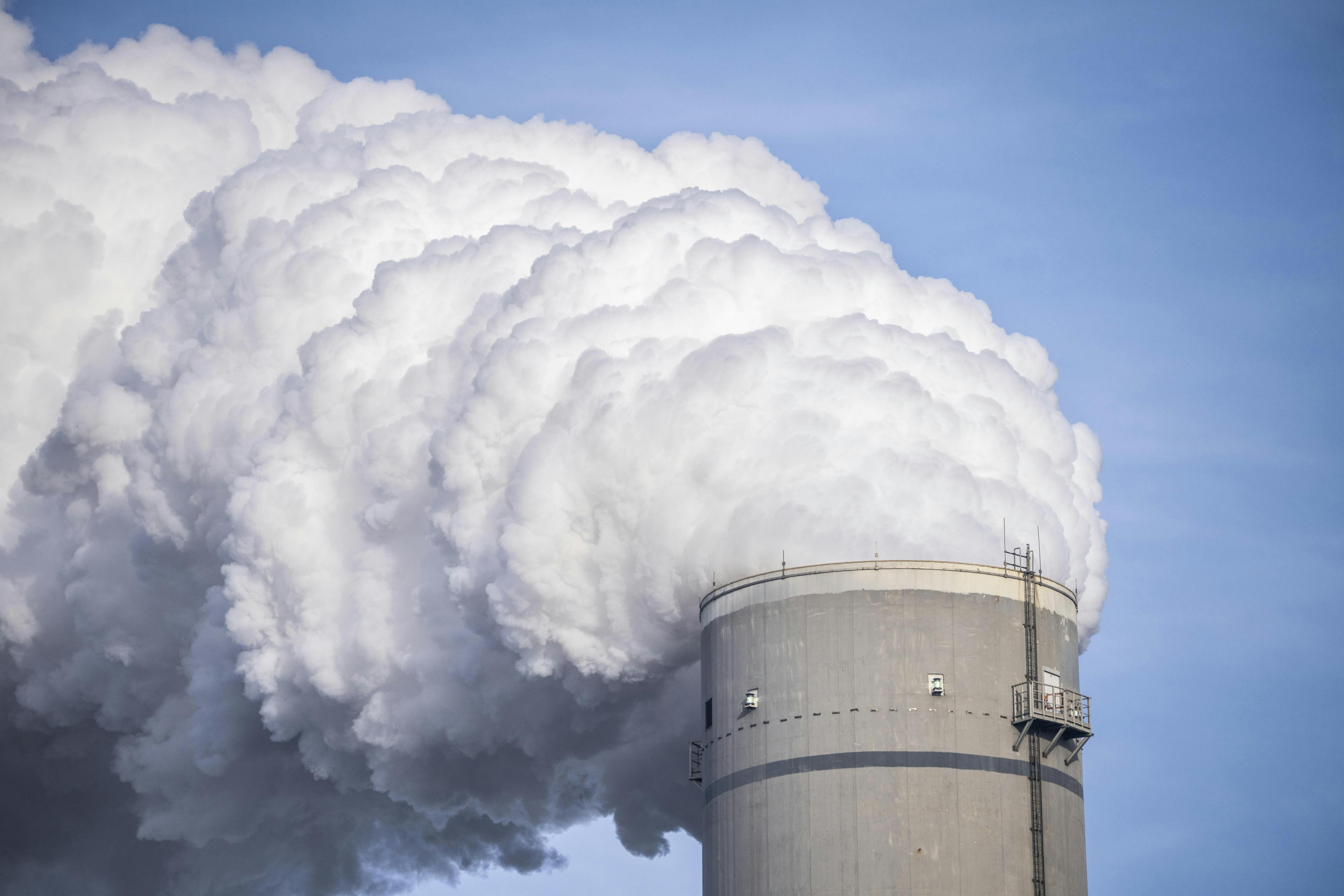 Thick rough rises from the chimney of a coal-fired power plant.