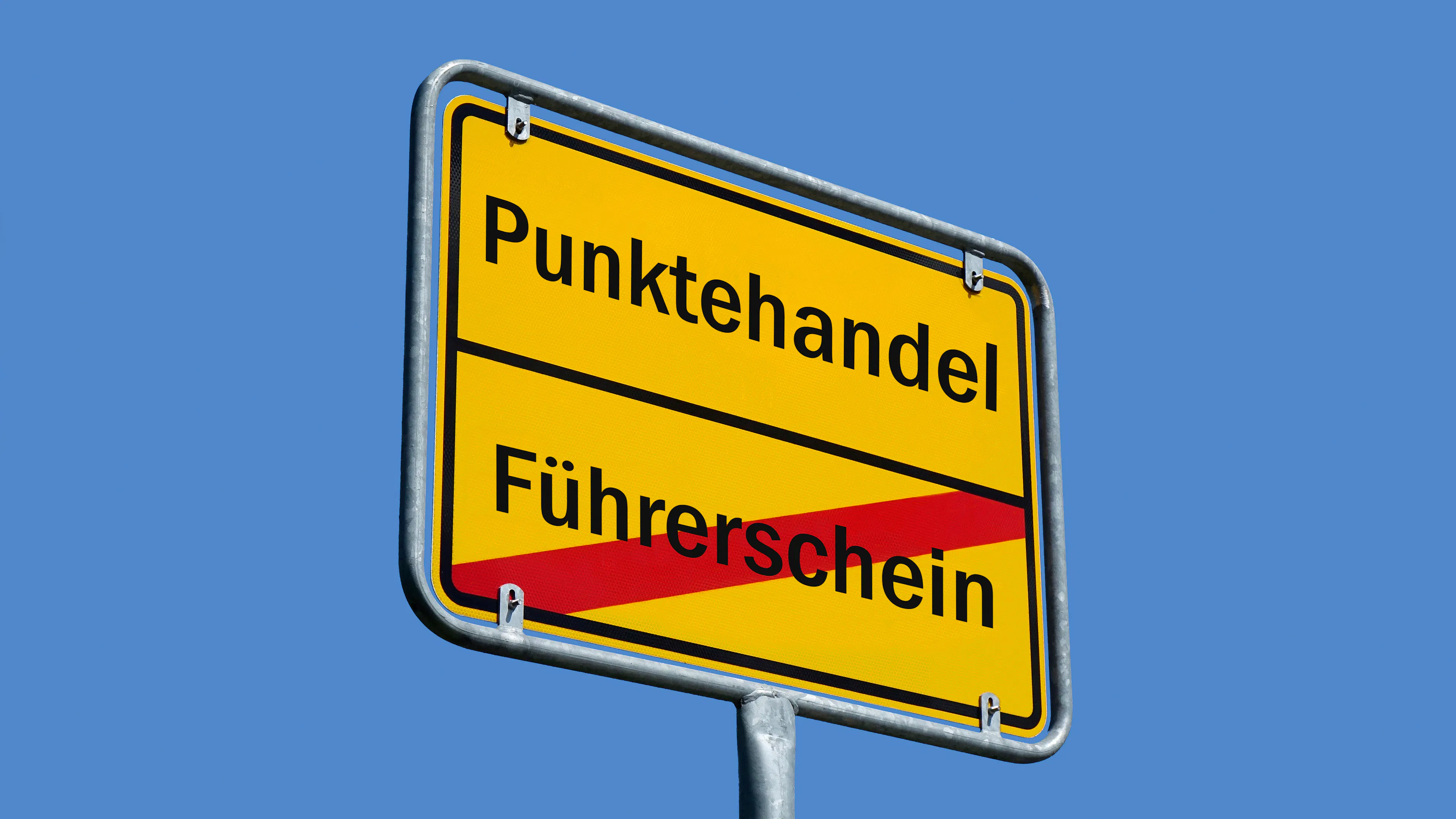 Auf einem Ortsschild stehen die Schriftzüge "Punktehandel" und "Führerschein".