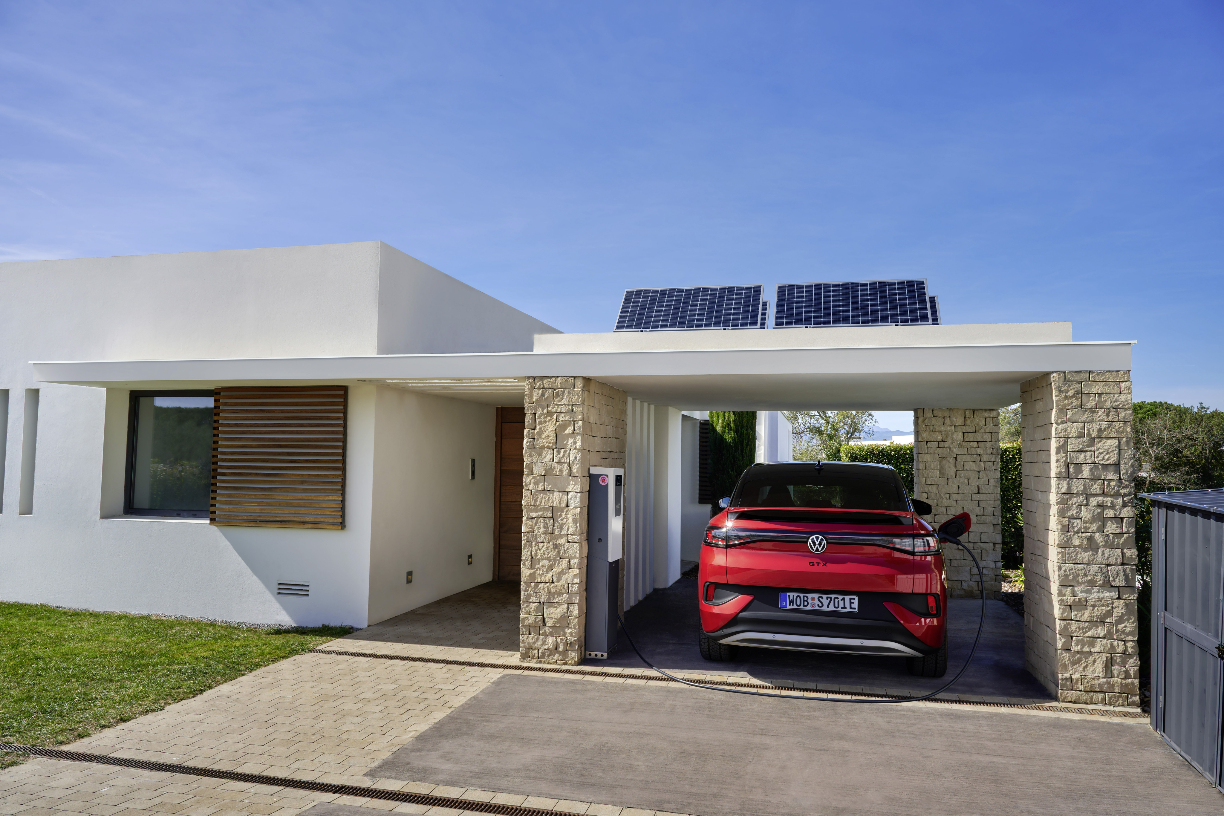 VW in carport charges with solar power