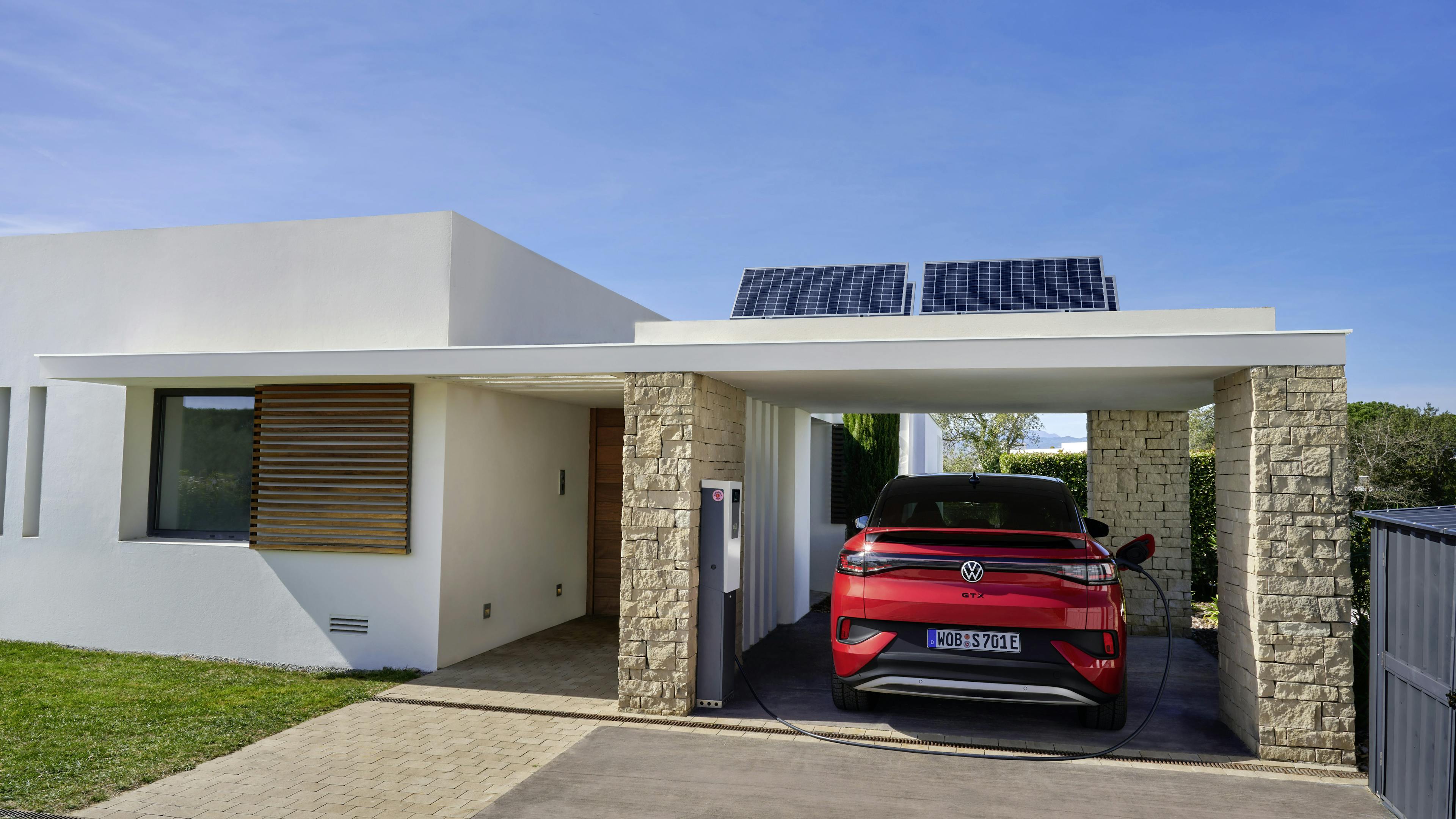VW in carport charges with solar power