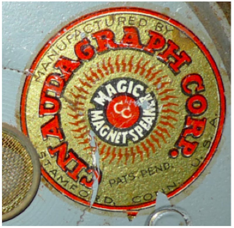 A sticker on the back of each speaker identifies the manufacturer as Cinaudagraph.