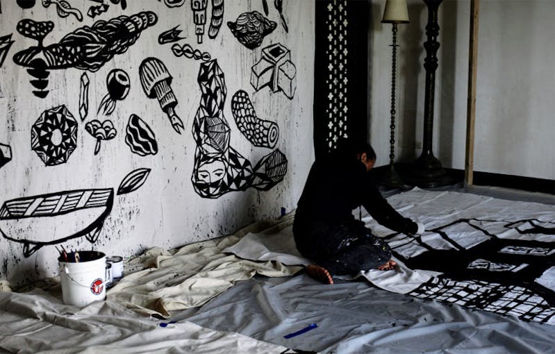 Artist in Residence Eko Nugroho working on site at Shangri La. Photo: Paige Donnelly