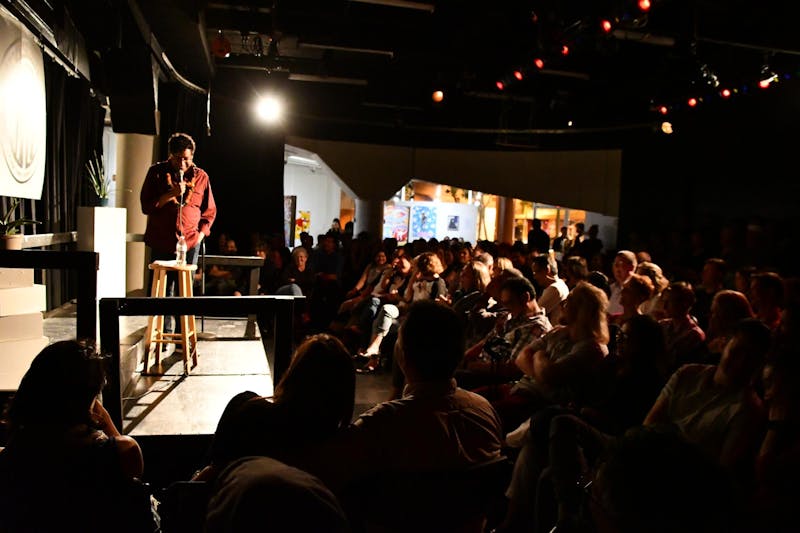 Hari Kondabolu performing standup in front of an audience at the ARTS at Mark's Garage, Honolulu.