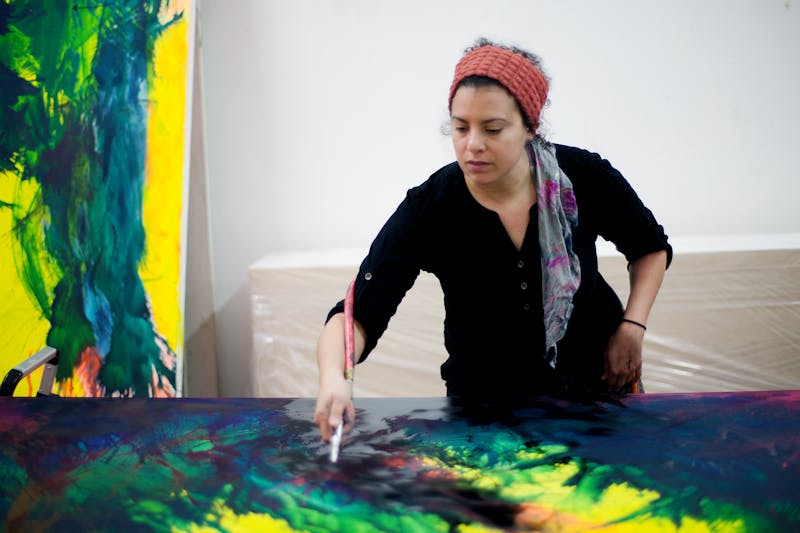 Sherin Guirguis painting in her studio.