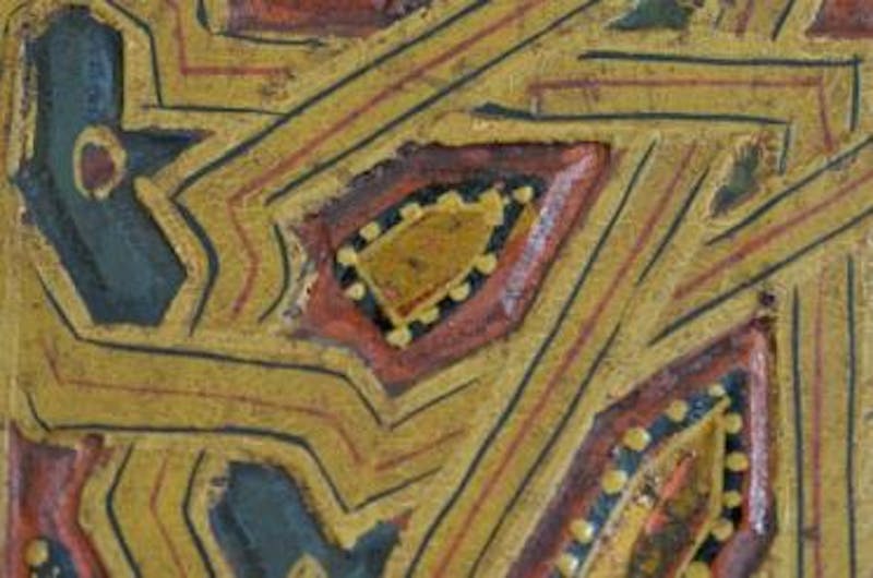 One of the few well-preserved areas of gilding on the living room doors. You can see that the metal leaf was applied in a regular rectangular shape (most likely to speed the process) and then the black outline was painted on top.
