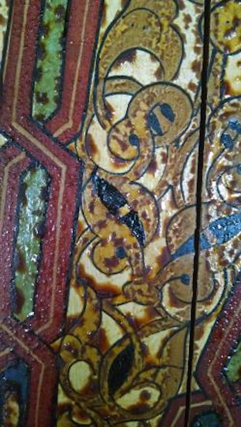 The lighter areas around the resin are where the original paint surface is more exposed because discolored varnish has been picked up by the exuding resin.