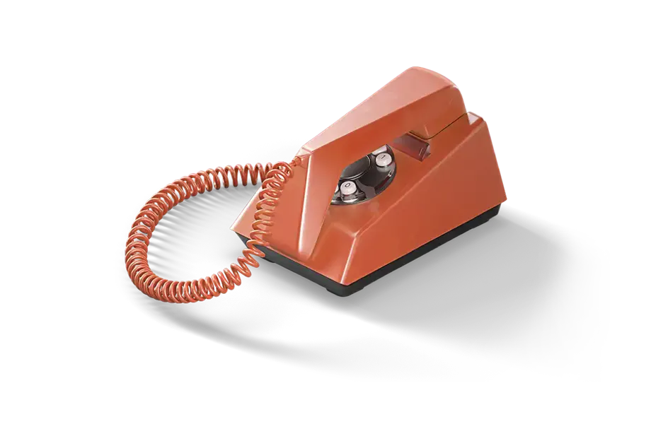A 70s-style landline phone with a spiral cord and a circle-shaped dial-pad reminiscent of rotary phones.