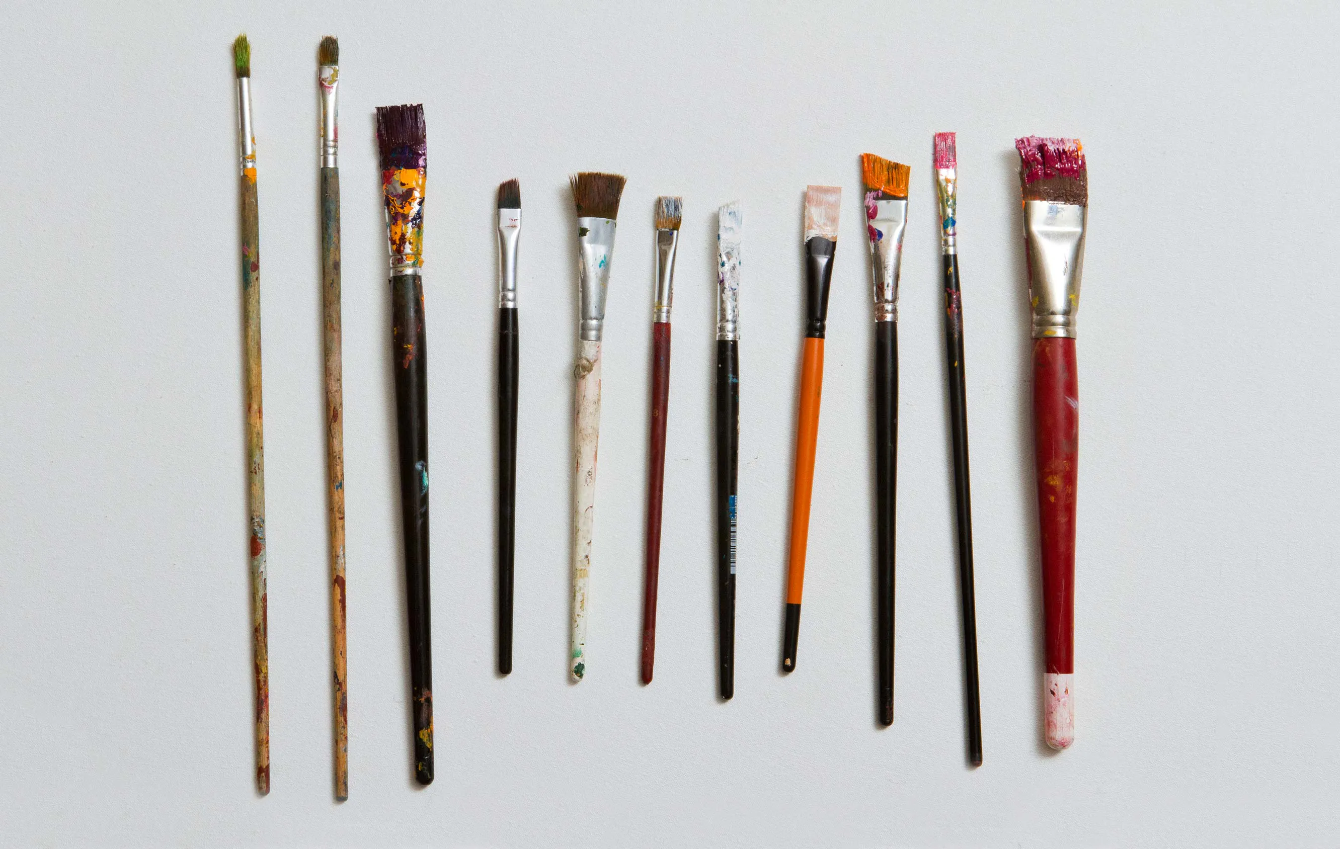 Different sized and shaped paint brushes side by side