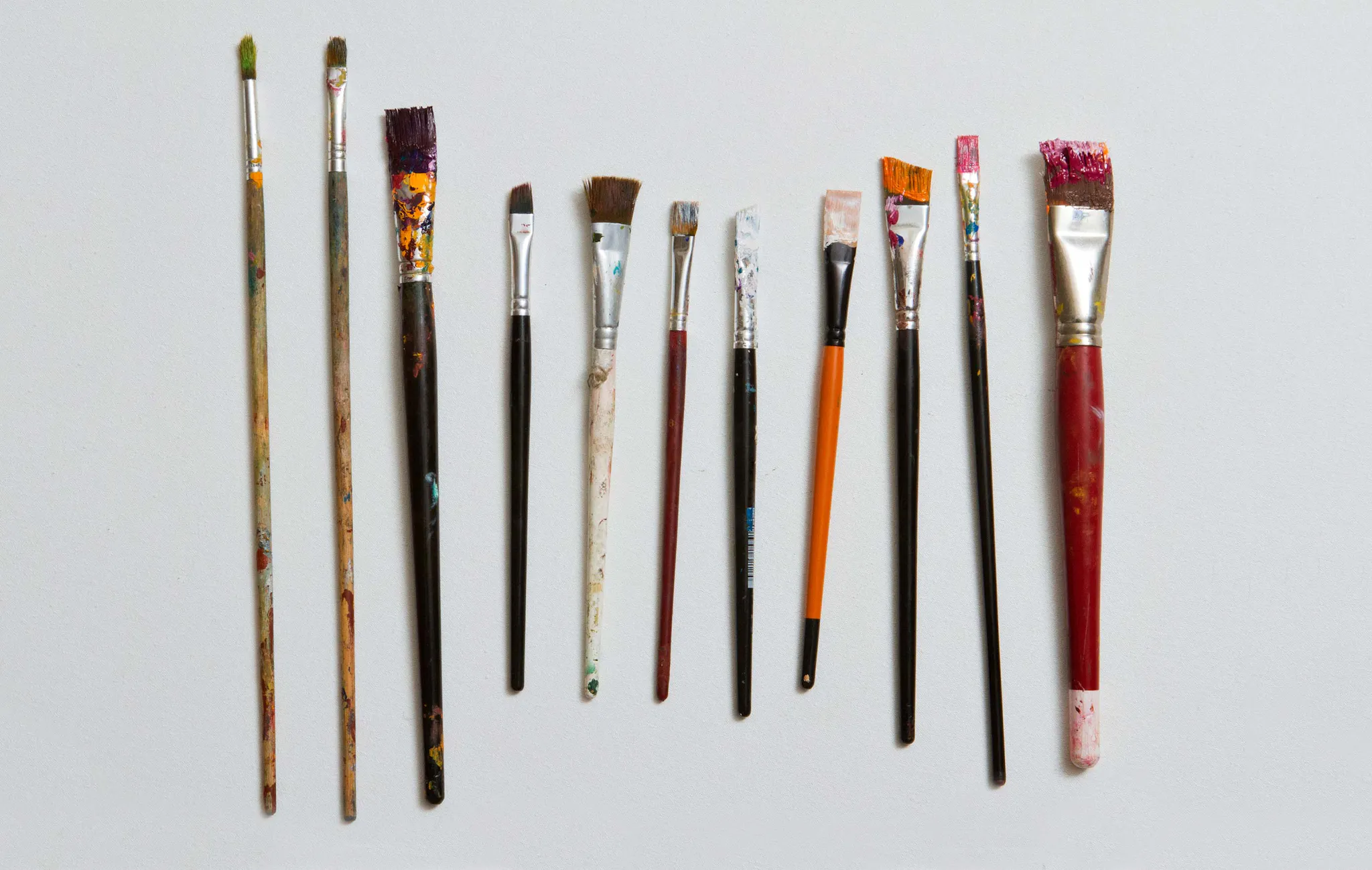 Different sized and shaped paint brushes side by side