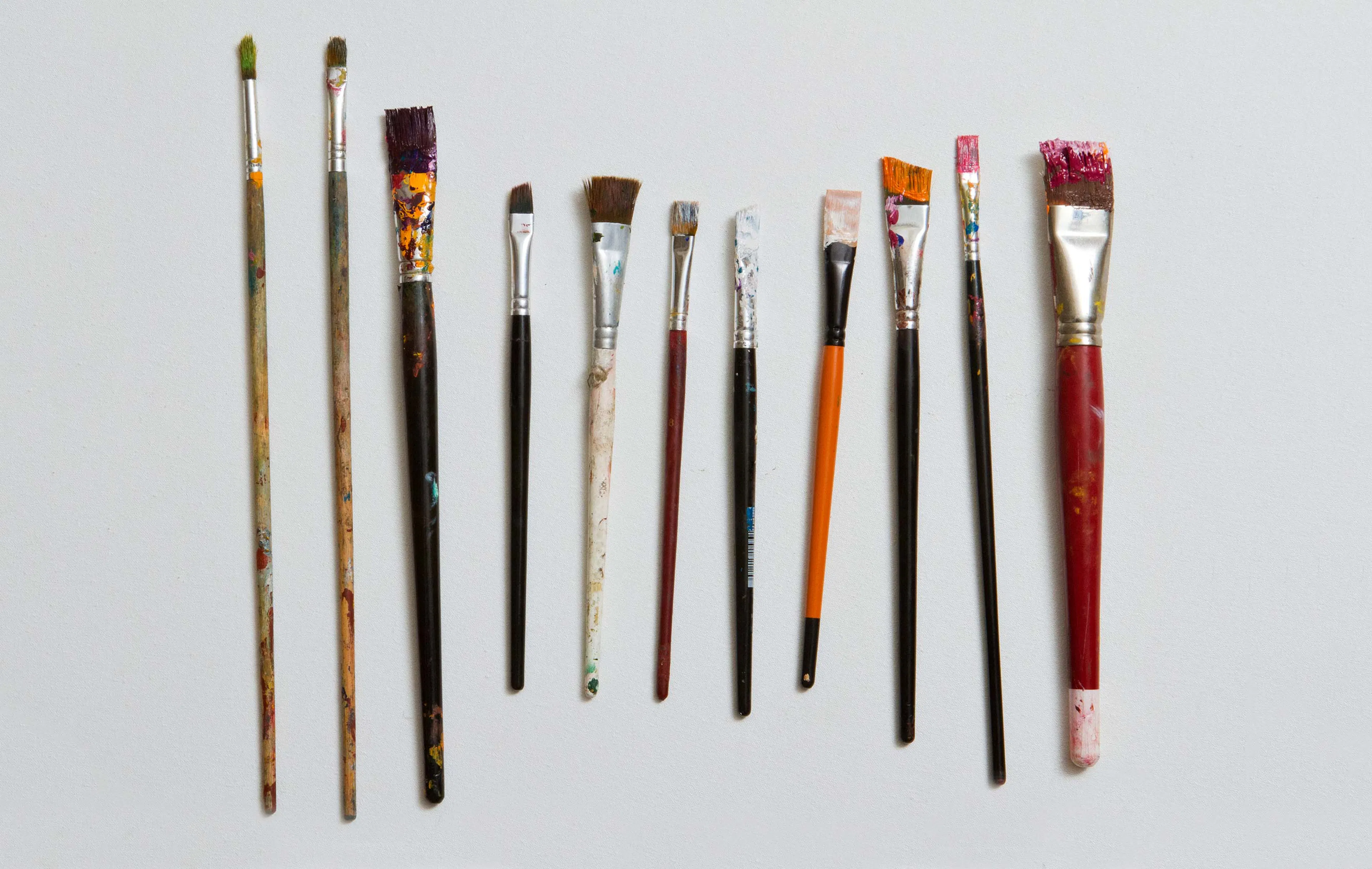 Different sized and shaped paint brushes side by side