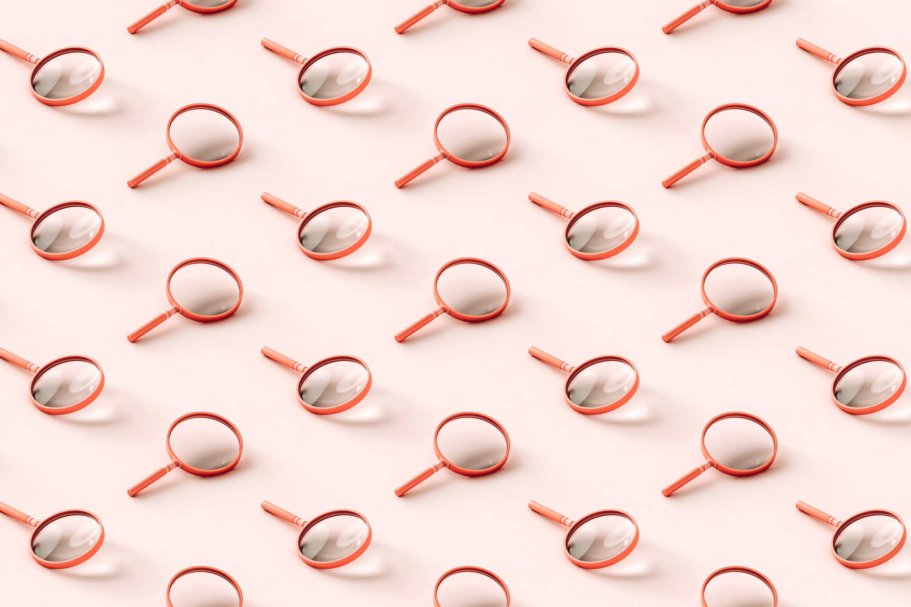 3D pattern of pink magnifying glasses on light pink background.