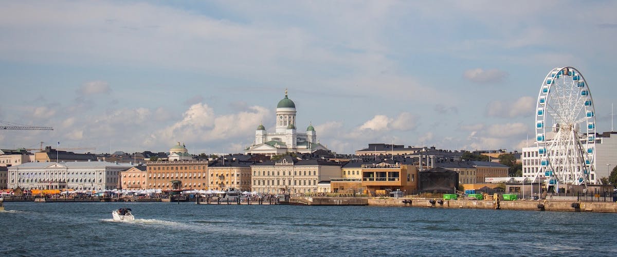 Helsinki photographed from the sea facing the market square and Helsinki Cathedral. The Helsinki Eye skywheel at the pier is on the right side of the image.