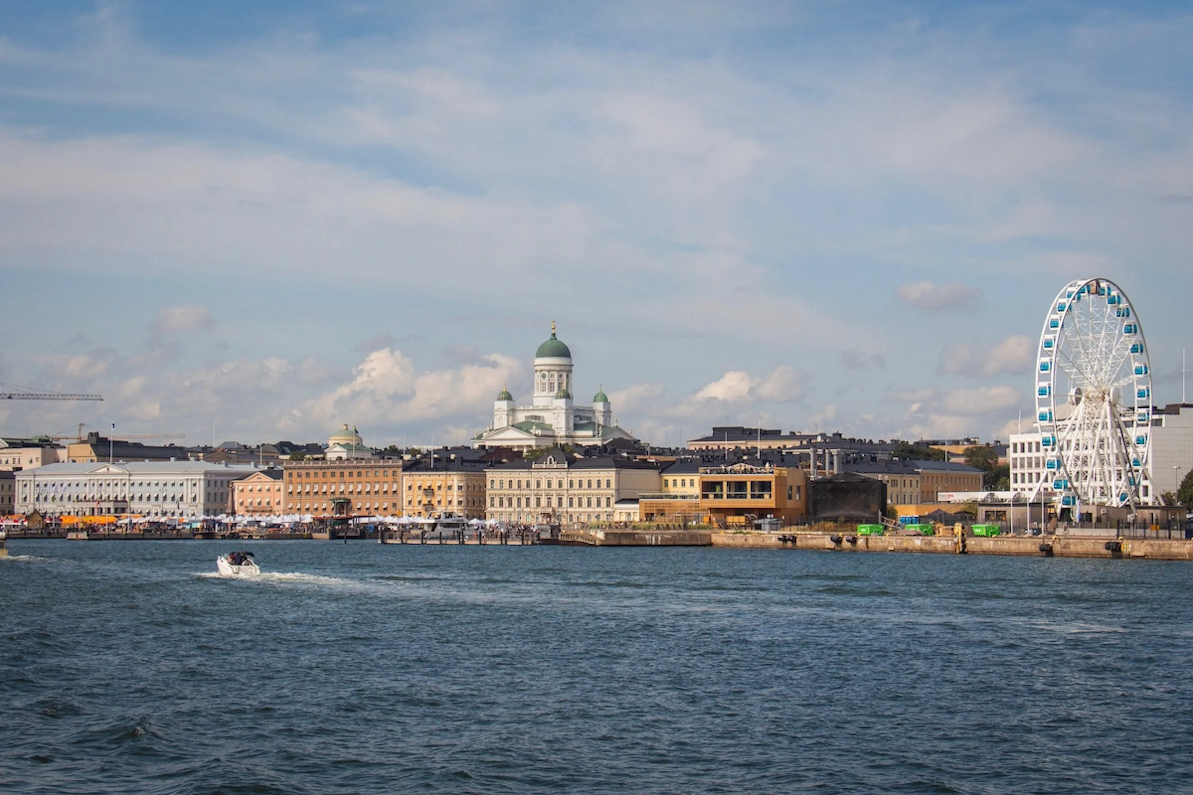 Helsinki photographed from the sea facing the market square and Helsinki Cathedral. The Helsinki Eye skywheel at the pier is on the right side of the image.
