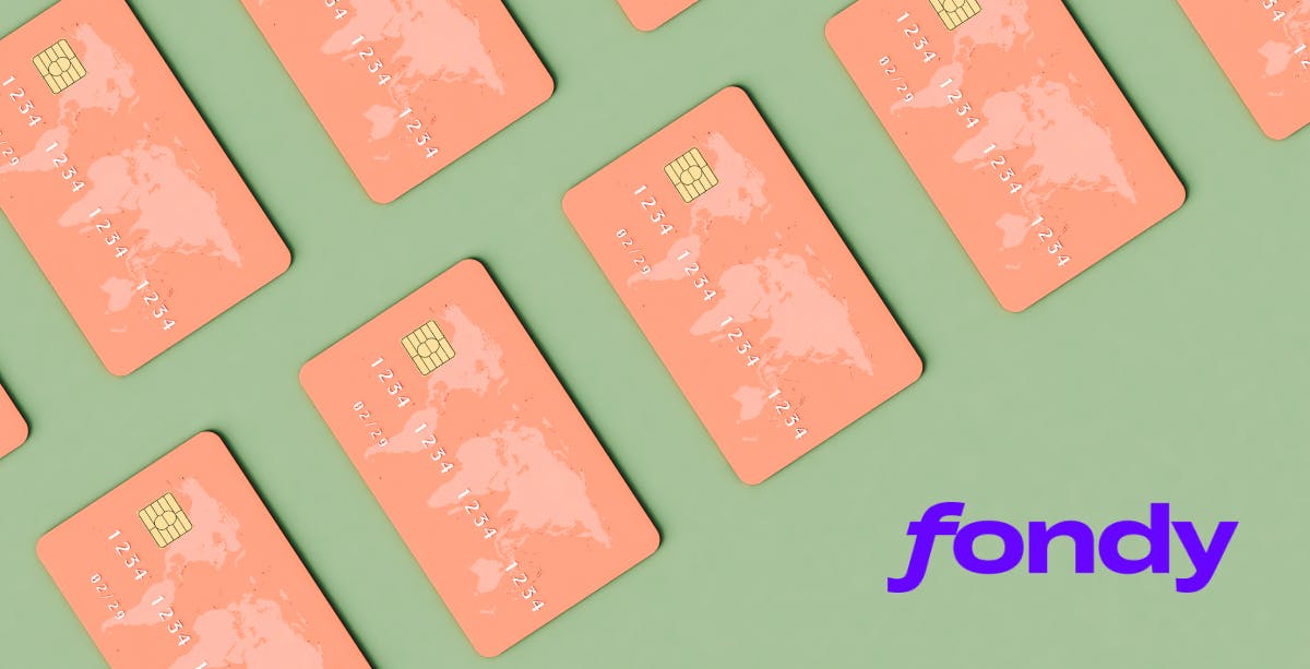 Sage green background with salmon pink credit cards with world map on the upper left corner, purple Fondy logo in bottom right corner.