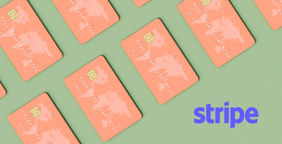 Sage green background with salmon pink credit cards with world map on the upper left corner, Stripe logo in bottom right corner. 