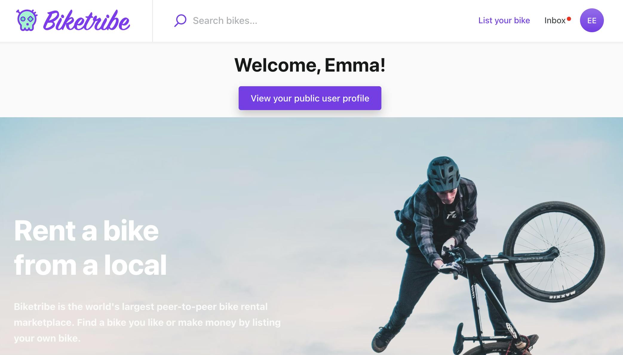 A fictional bike marketplace landing page with a section where on white background, there is a title "Welcome, Emma"! and a button with text "View your public user profile". Under this section, there is a large image of a person doing a bicycle trick and a text "Rent a bike from a local".