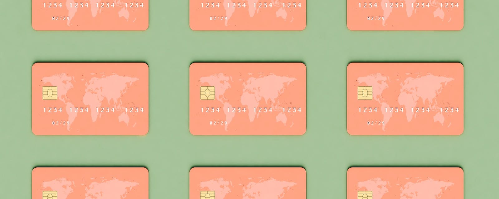 Nine orange credit cards with the picture of the world map arranged in a symmetrical grid against a light green background.