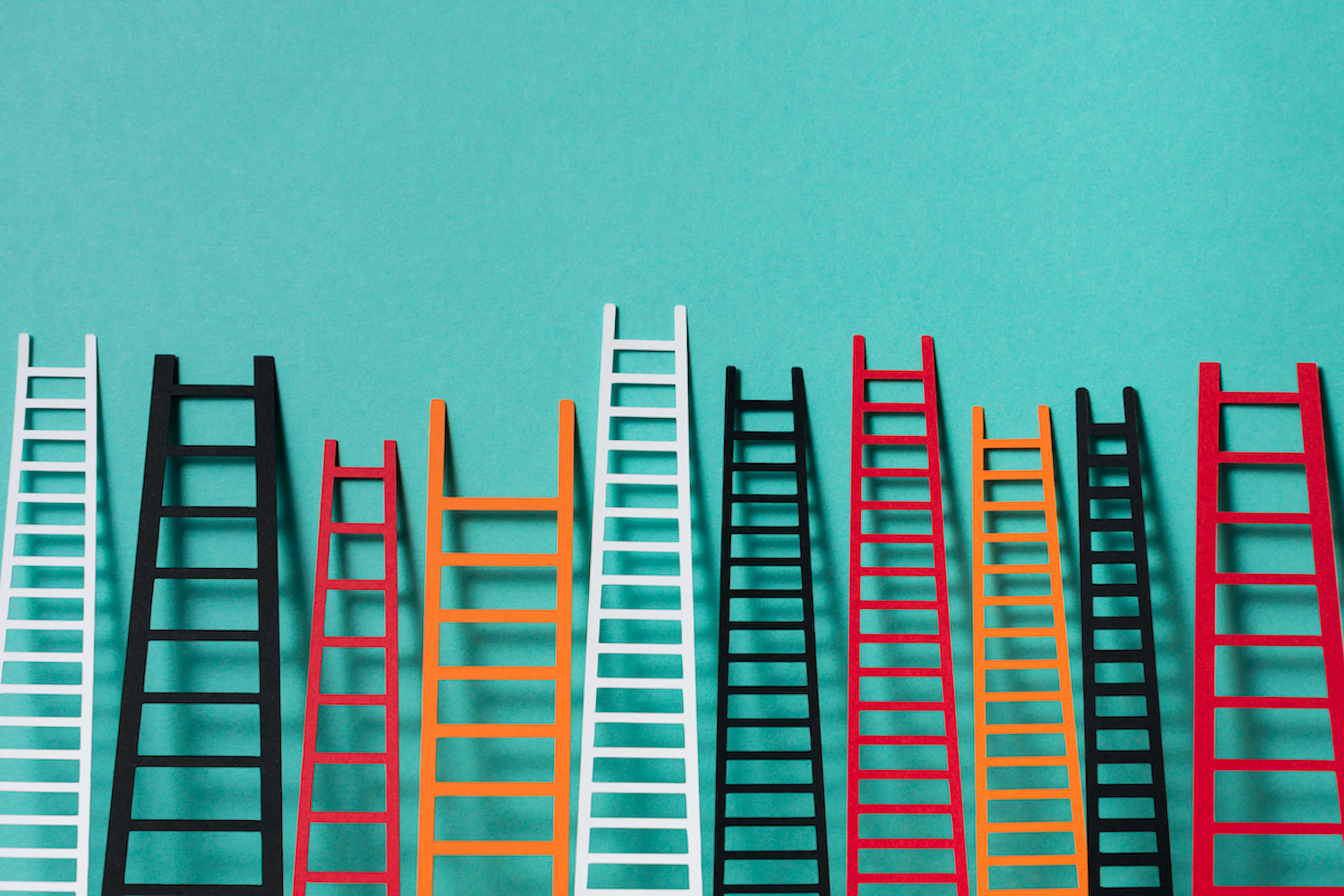Ladders in a wall representing marketplace supply growth. Made with paper.