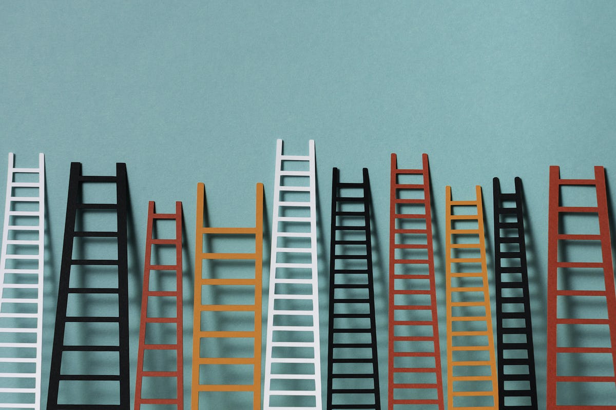Ladders in a wall representing marketplace supply growth. Made with paper.