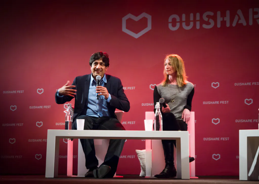 Arun Sundararajan speaking in a panel discussion at OuiShareFest. Photo by Antti Virolainen.