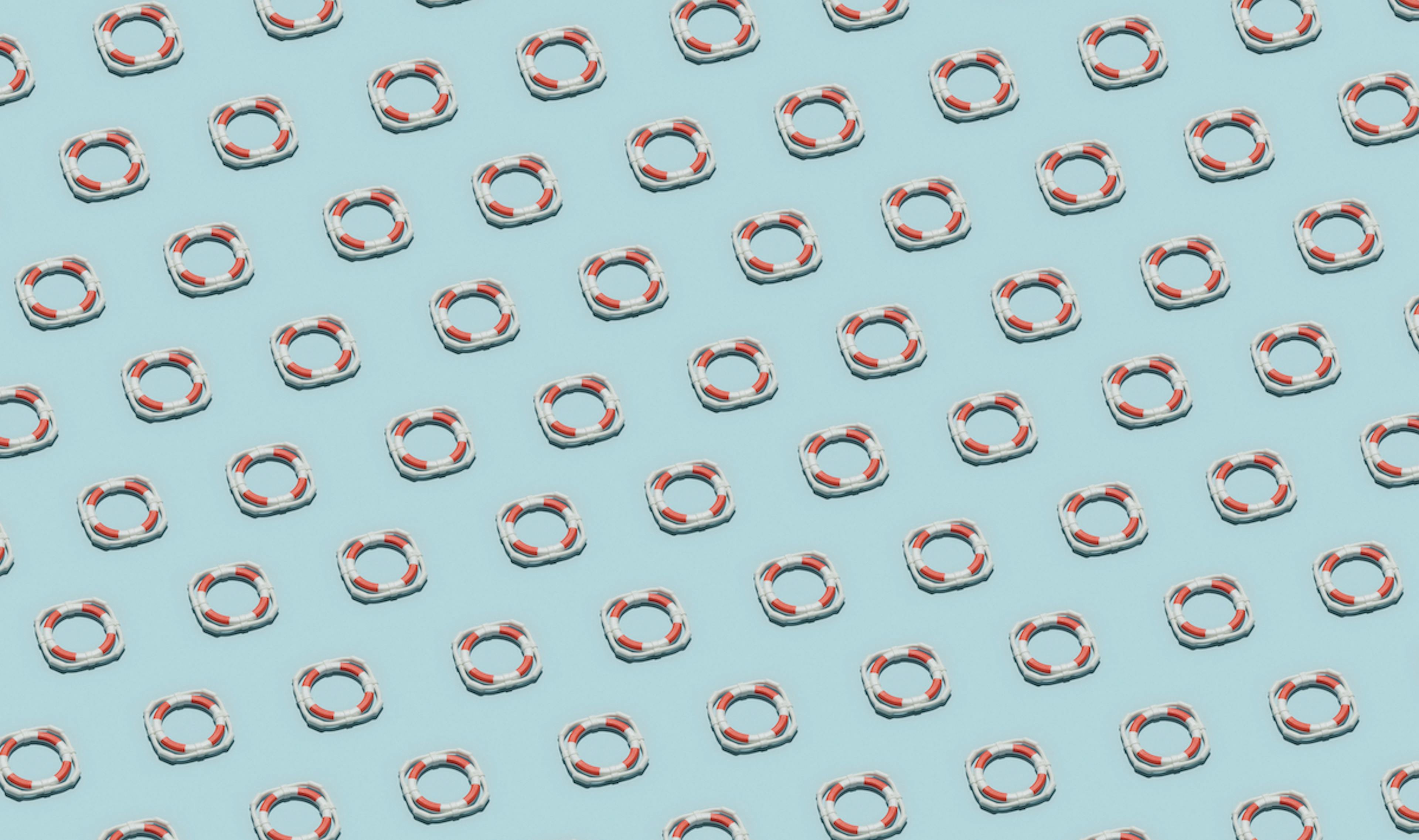 Red-and-white ifebuoys arranged in sequence.