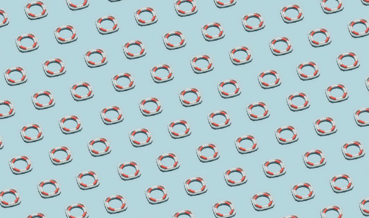 Red-and-white ifebuoys arranged in sequence.