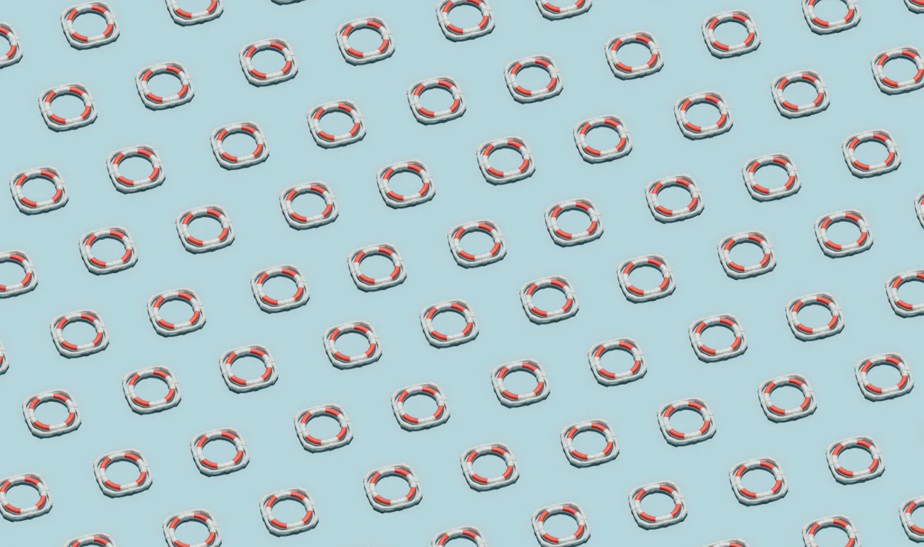 Red-and-white ifebuoys arranged in sequence.