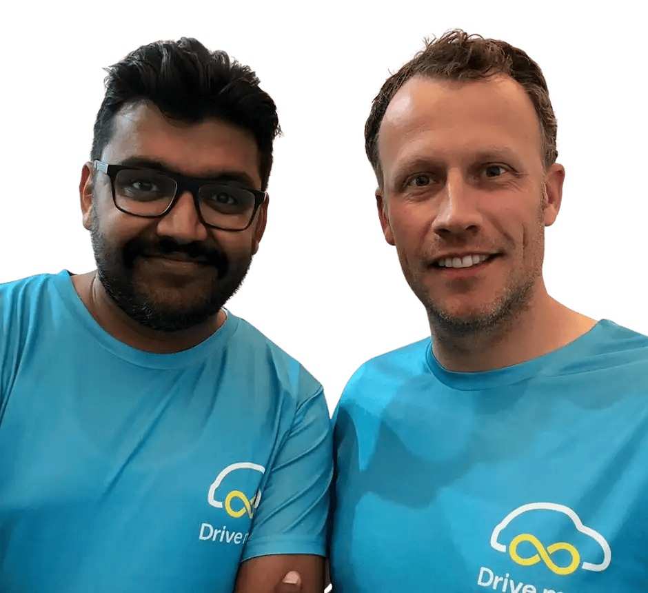 Gaurav and Dirk, wearing light turqoise Drivel lah t-shirts.