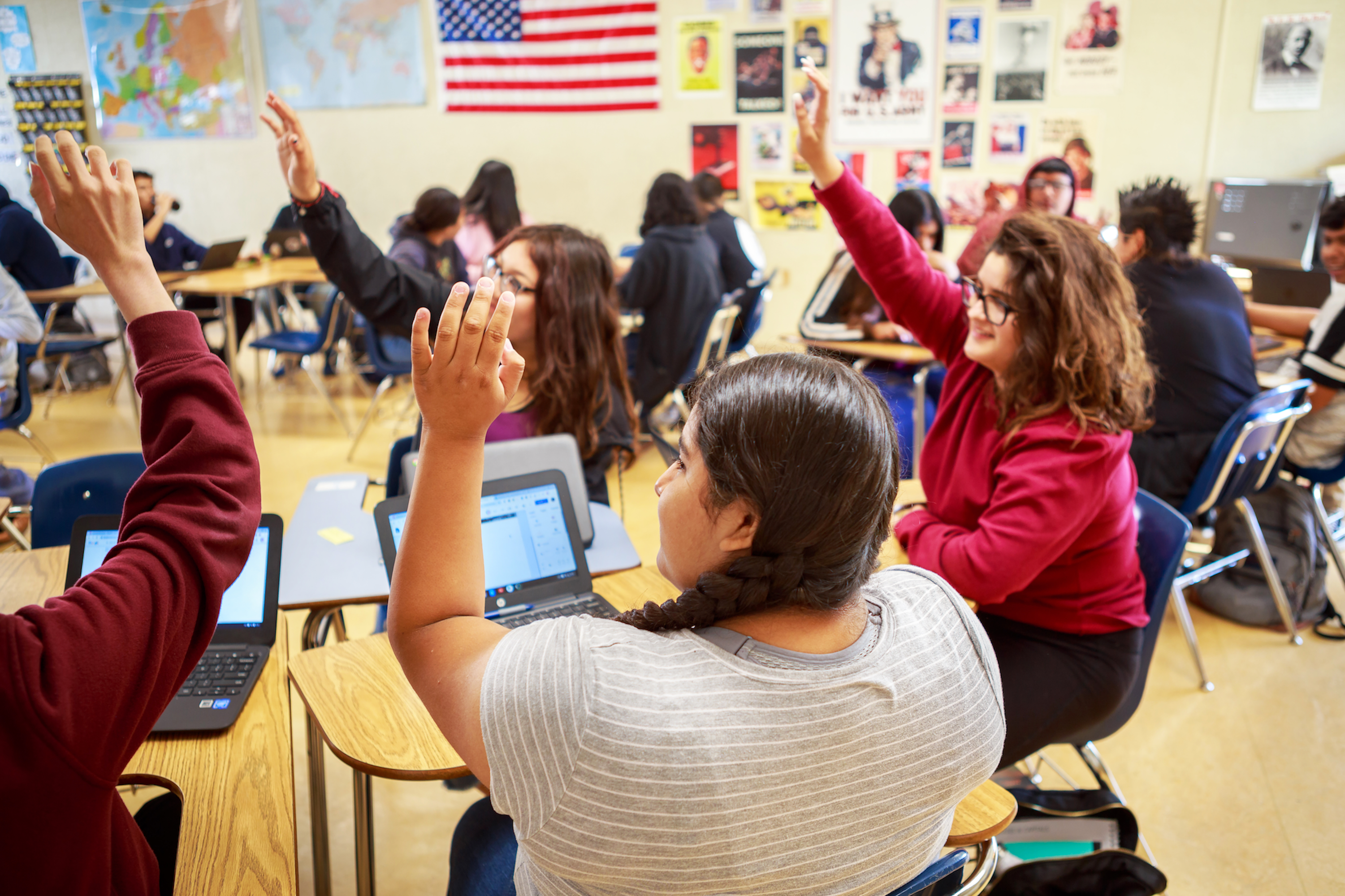 Students raising hands