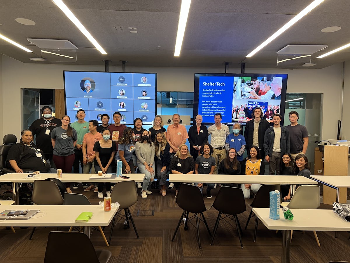 Group shot of hybrid Datathon at Cisco Meraki SF, June 2022, with volunteeers joining in person and virtually to vet the data in SF Service Guide