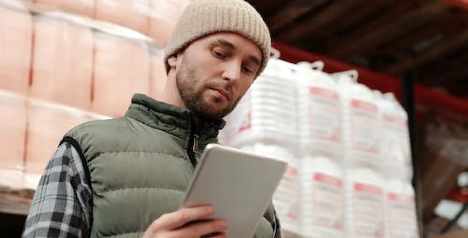 Man looking down at tablet