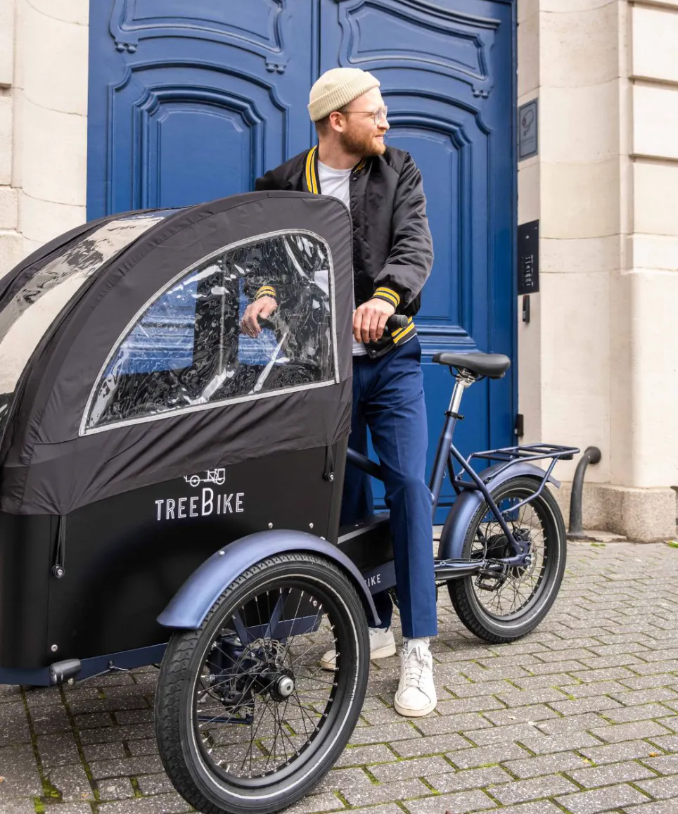 Person with hat on treebike