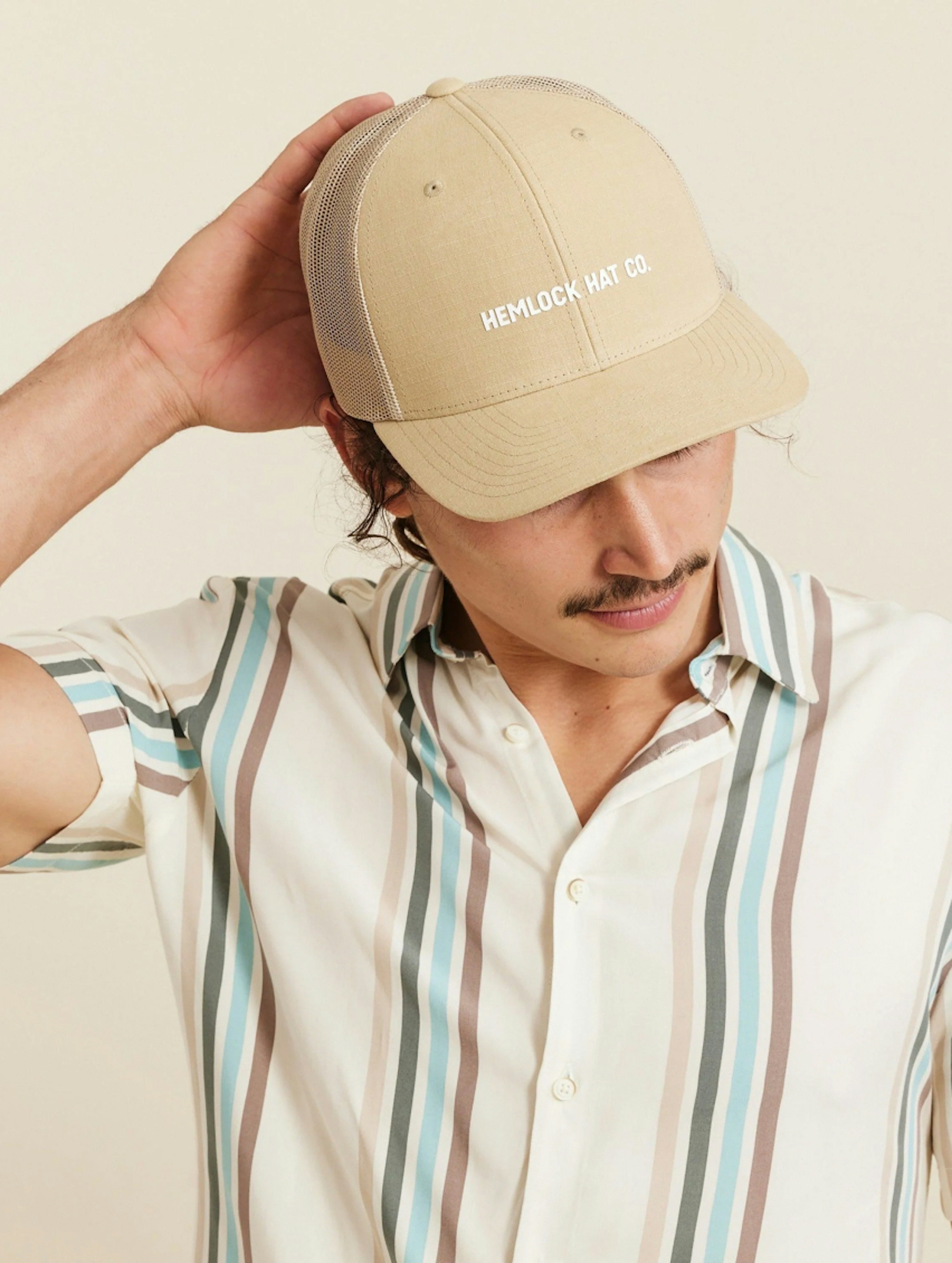 Man wearing a Hemlock ballcap